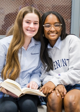 Logic School Girls sharing a book