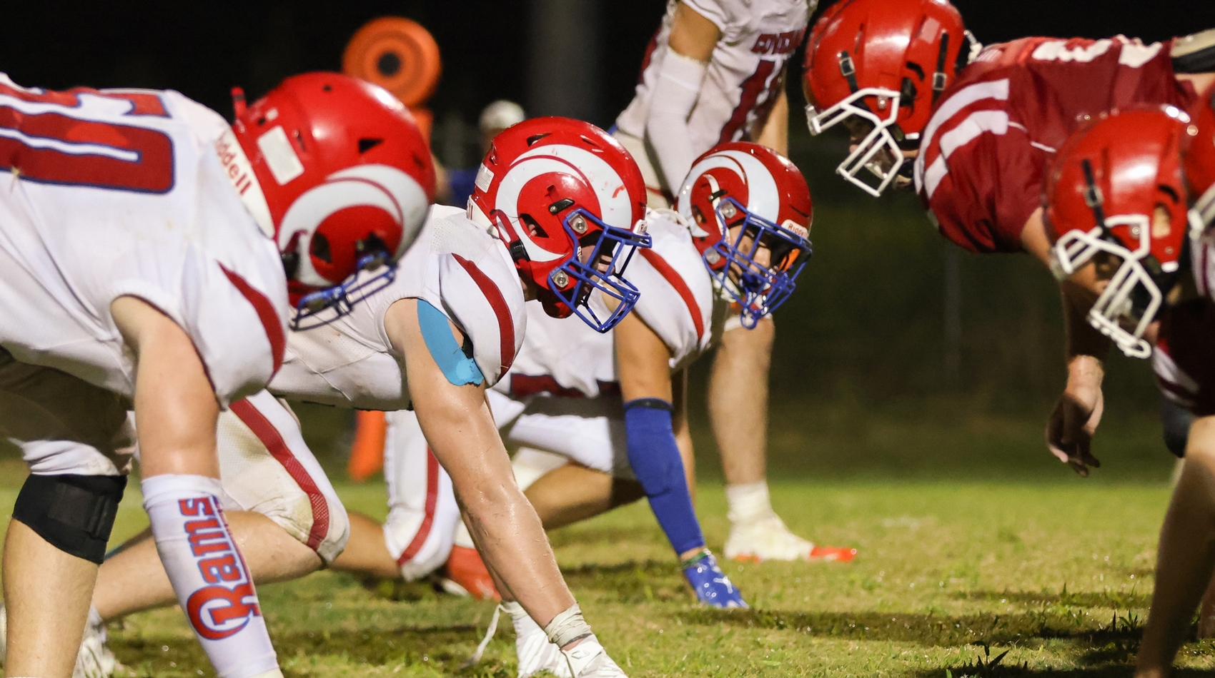 Football players lined up on the line of scrimmage